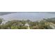 Lakefront property aerial view, showcasing house and lake access at 18315 Dells Cv, Groveland, FL 34736