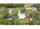 Aerial view showing a white house and surrounding homes at 18315 Dells Cv, Groveland, FL 34736
