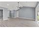 Spacious living room with high ceilings and hardwood floors at 18315 Dells Cv, Groveland, FL 34736