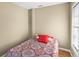 Cozy bedroom with a window allowing ample natural light at 18415 County Road 33, Groveland, FL 34736
