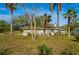 Picture of the rear exterior of the home featuring a well-manicured yard at 18415 County Road 33, Groveland, FL 34736