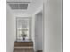 Hallway with window sill, brick planter and flower vase at 18415 County Road 33, Groveland, FL 34736