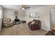 Comfortable living area with wood-look floors and a cozy layout with pass through window at 18415 County Road 33, Groveland, FL 34736