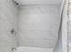 Walk in shower featuring white subway tile surround and chrome hardware at 18415 County Road 33, Groveland, FL 34736