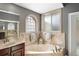 Bathroom featuring soaking tub with tile surround and windows at 2251 Lakeside Ter, Eustis, FL 32726