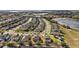 Aerial view of a neighborhood with beautiful green spaces, a pond and convenient road access at 2455 Hastings Blvd, Clermont, FL 34711