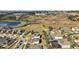 Aerial view of a neighborhood with manicured yards and mature trees, some homes with screened in pools at 2455 Hastings Blvd, Clermont, FL 34711