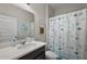 Bathroom featuring vanity, toilet, shower with fun sea-themed curtain at 2455 Hastings Blvd, Clermont, FL 34711