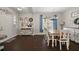 Inviting dining room featuring a wood table, white chairs, and decor at 2455 Hastings Blvd, Clermont, FL 34711