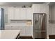 Bright kitchen with white cabinets, stainless steel appliances, and ample storage at 2455 Hastings Blvd, Clermont, FL 34711