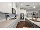 Well-equipped kitchen features sleek appliances, stylish backsplash, and ample counter space for cooking at 2455 Hastings Blvd, Clermont, FL 34711