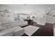 Open-concept living room with kitchen views, elegant furnishings, and natural light at 2455 Hastings Blvd, Clermont, FL 34711