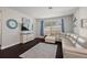 Cozy living room with large windows, comfortable seating, and stylish decor at 2455 Hastings Blvd, Clermont, FL 34711