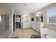 Main bathroom features double sinks, soaking tub, glass shower, and a walk-in closet at 2455 Hastings Blvd, Clermont, FL 34711