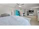 Bright main bedroom with walk-in closet, ceiling fan, and a king bed at 2455 Hastings Blvd, Clermont, FL 34711