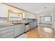 Updated kitchen featuring granite counters and gray subway tile backsplash at 2685 Cr 776, Webster, FL 33597