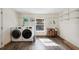 Bright laundry area with modern washer and dryer, and ample storage shelves at 2685 Cr 776, Webster, FL 33597