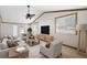 Bright living room features vaulted ceilings, exposed wood beams, and stylish furnishings at 2685 Cr 776, Webster, FL 33597