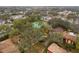 Apartment complex featuring mature trees, tennis courts, and a swimming pool at 2804 N Powers Dr # 27, Orlando, FL 32818
