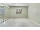Bedroom with tile flooring, neutral walls, a window and mirrored closet doors at 2804 N Powers Dr # 27, Orlando, FL 32818