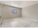 Bright bedroom with a window and tile flooring offers a comfortable and clean living space at 2804 N Powers Dr # 27, Orlando, FL 32818