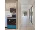 A modern kitchen featuring stainless steel appliances, sleek countertops, and a well-lit dining area at 2804 N Powers Dr # 27, Orlando, FL 32818