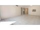 Spacious living room featuring tile flooring, neutral walls, and ample natural light from a sliding glass door at 2804 N Powers Dr # 27, Orlando, FL 32818