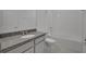 This bathroom features a granite countertop with a large shower and bathtub at 2854 Supermarine Rd, Tavares, FL 32778