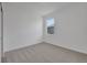 This bedroom has carpet and a single window at 2854 Supermarine Rd, Tavares, FL 32778