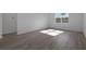 Bedroom featuring hardwood floors, a window and white walls at 2854 Supermarine Rd, Tavares, FL 32778