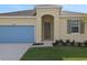 Close up of home's front entrance and 2 car garage at 2854 Supermarine Rd, Tavares, FL 32778