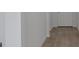 Entryway of home featuring hardwood style flooring and white walls and trim at 2854 Supermarine Rd, Tavares, FL 32778