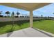 Covered patio view showcasing the backyard, fence and view at 2854 Supermarine Rd, Tavares, FL 32778