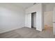Bedroom with neutral carpet, closet and adjacent door at 2932 Supermarine Rd, Tavares, FL 32778