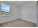 Comfortable bedroom features neutral carpet, white walls and a window view at 2932 Supermarine Rd, Tavares, FL 32778