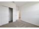 Bedroom with neutral carpet, closet and adjacent door at 2932 Supermarine Rd, Tavares, FL 32778