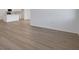 Spacious living room featuring wood-look floors and natural light at 2932 Supermarine Rd, Tavares, FL 32778