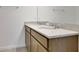 Bright bathroom featuring double sink vanity with light wood cabinets and granite countertop at 2950 Supermarine Rd, Tavares, FL 32778