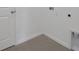 Corner featuring tile flooring and white walls, with essential fittings for appliances and modern convenience at 2950 Supermarine Rd, Tavares, FL 32778