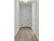 Welcoming entryway featuring light wood-look flooring and a white front door, creating a clean and bright entrance at 2950 Supermarine Rd, Tavares, FL 32778