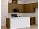 Kitchen with stainless steel appliances, light brown cabinets and center island at 2950 Supermarine Rd, Tavares, FL 32778