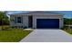 Charming single-story home with a well-manicured lawn and a two-car garage at 2968 Supermarine Rd, Tavares, FL 32778
