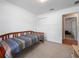 Neutral bedroom featuring a daybed, carpet flooring, and a closet for ample storage space at 31234 Chevy Chase Dr, Sorrento, FL 32776