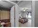 Light and bright full bathroom connected to bedroom with a tiled floor and shower with a curtain at 3215 Park Branch Ave, Clermont, FL 34711