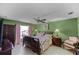 Bedroom featuring green paint, neutral floors, and bright windows at 3215 Park Branch Ave, Clermont, FL 34711