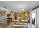 Inviting kitchen featuring an island, stainless steel appliances, and an adjacent dining area at 3215 Park Branch Ave, Clermont, FL 34711