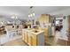 Charming kitchen features a center island, modern appliances and is open to the dining and living areas at 3215 Park Branch Ave, Clermont, FL 34711