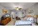 Comfortable primary bedroom with ceiling fan, closet space, and access to an en suite bath at 3215 Park Branch Ave, Clermont, FL 34711