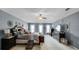 Spacious main bedroom with plush carpeting, a ceiling fan, and multiple windows for natural light at 3215 Park Branch Ave, Clermont, FL 34711