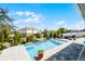 Relaxing pool area featuring a hammock and lounge furniture, perfect for outdoor enjoyment at 3215 Park Branch Ave, Clermont, FL 34711